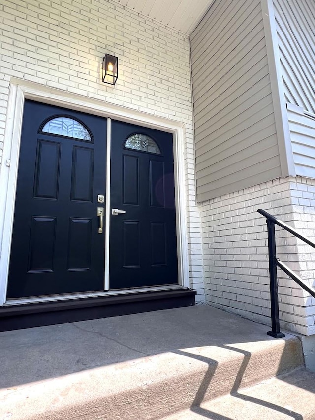 entrance to property with brick siding