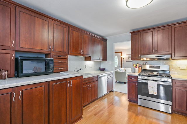 3101 Saint James St, Rolling Meadows, IL 60008 - kitchen featuring stainless steel appliances, under cabinet range hood, tasteful backsplash, light wood-type flooring, and crown molding