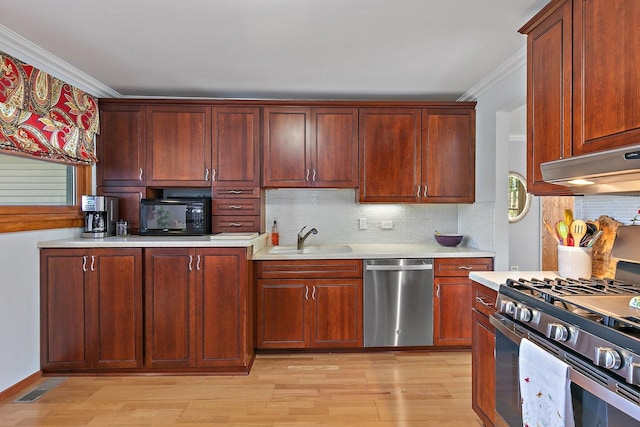 3101 Saint James St, Rolling Meadows, IL 60008 - kitchen with appliances with stainless steel finishes, a sink, ornamental molding, light countertops, and light wood-type flooring