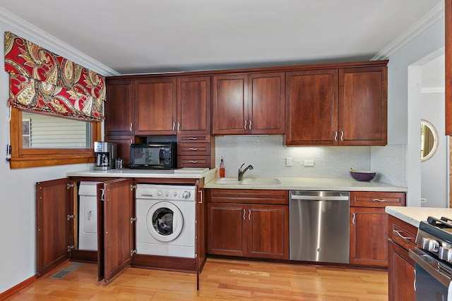 3101 Saint James St, Rolling Meadows, IL 60008 - kitchen featuring appliances with stainless steel finishes, washer / dryer, a sink, ornamental molding, and light countertops