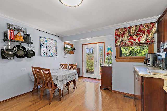 3101 Saint James St, Rolling Meadows, IL 60008 - dining room with light wood-type flooring, crown molding, and baseboards