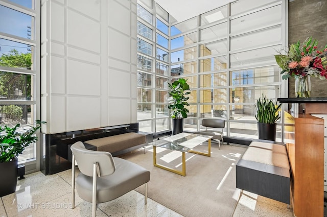 700 N Larrabee St Unit 905, Chicago, IL 60654 - building lobby featuring a high ceiling, floor to ceiling windows, and a decorative wall