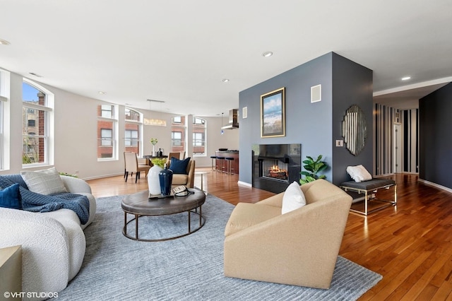 501 N Kingsbury St Unit G, Chicago, IL 60654 - living room with healthy amount of natural light, wood finished floors, recessed lighting, a chandelier, and a warm lit fireplace