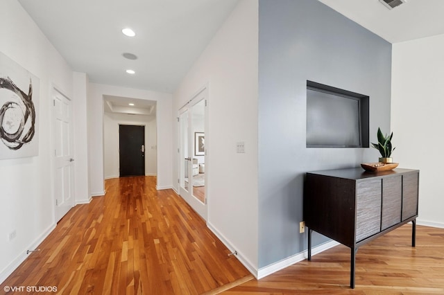 501 N Kingsbury St Unit G, Chicago, IL 60654 - hallway with light wood-style flooring, recessed lighting, and baseboards