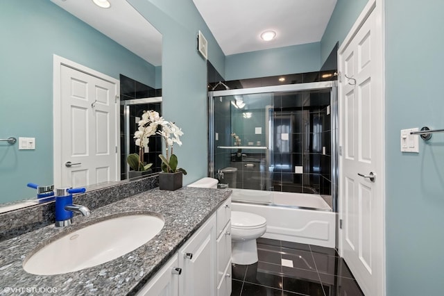 501 N Kingsbury St Unit G, Chicago, IL 60654 - bathroom with vanity, enclosed tub / shower combo, toilet, and tile patterned floors