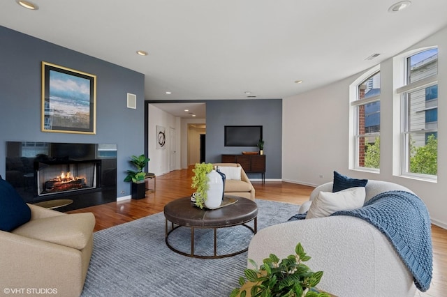 501 N Kingsbury St Unit G, Chicago, IL 60654 - living room with wood finished floors, a lit fireplace, recessed lighting, and baseboards