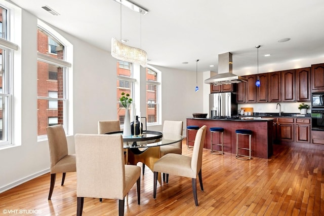501 N Kingsbury St Unit G, Chicago, IL 60654 - dining room featuring light wood-style floors, recessed lighting, and baseboards