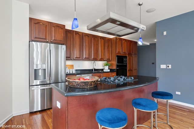 501 N Kingsbury St Unit G, Chicago, IL 60654 - kitchen with black appliances, dark countertops, wood finished floors, range hood, and baseboards