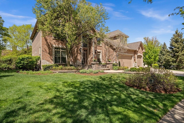 1021 Fire Fox Ct, Saint Charles, IL 60174 - view of front of house with a garage, brick siding, and a front lawn