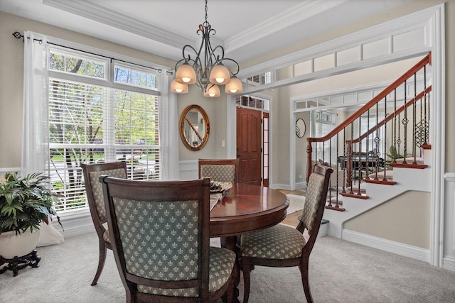 1021 Fire Fox Ct, Saint Charles, IL 60174 - carpeted dining area with a chandelier, crown molding, and stairs