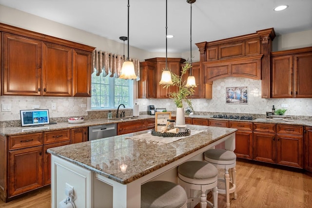 1021 Fire Fox Ct, Saint Charles, IL 60174 - kitchen with a sink, light wood-type flooring, light stone countertops, dishwasher, and a center island