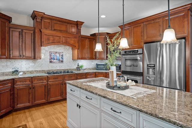 1021 Fire Fox Ct, Saint Charles, IL 60174 - kitchen featuring stainless steel appliances, light wood-style flooring, tasteful backsplash, light stone counters, and recessed lighting