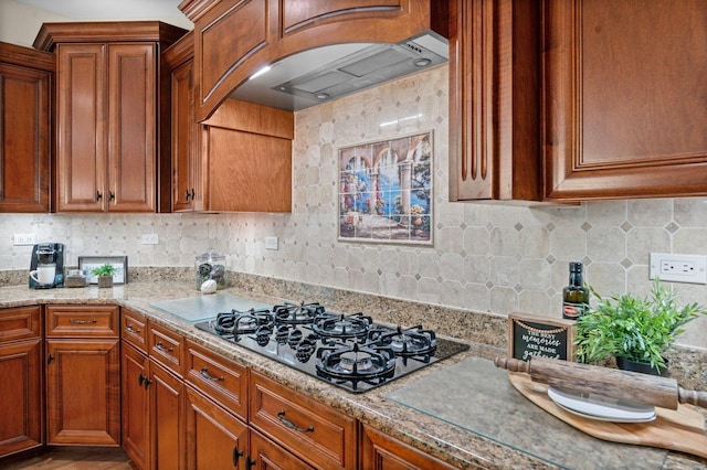 1021 Fire Fox Ct, Saint Charles, IL 60174 - kitchen featuring black gas stovetop, range hood, brown cabinets, and backsplash