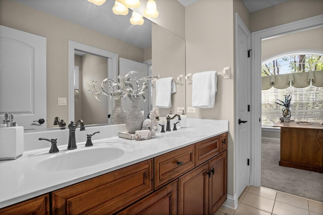 1021 Fire Fox Ct, Saint Charles, IL 60174 - bathroom featuring tile patterned flooring, double vanity, healthy amount of natural light, and a chandelier