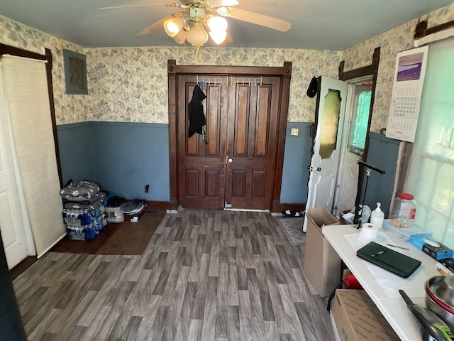 207 W Williams St, Dwight, IL 60420 - entrance foyer with wallpapered walls, a wainscoted wall, ceiling fan, and wood finished floors