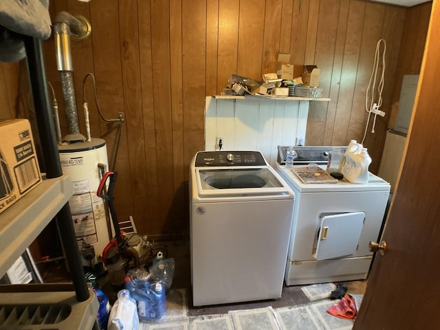 207 W Williams St, Dwight, IL 60420 - clothes washing area featuring water heater, washing machine and dryer, and wood walls