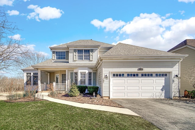 0N745 Bartelt Rd, Geneva, IL 60134 - traditional-style home featuring driveway, a porch, an attached garage, a front yard, and a shingled roof