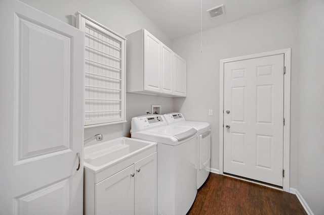 0N745 Bartelt Rd, Geneva, IL 60134 - clothes washing area featuring washer and dryer, cabinet space, dark wood finished floors, and baseboards