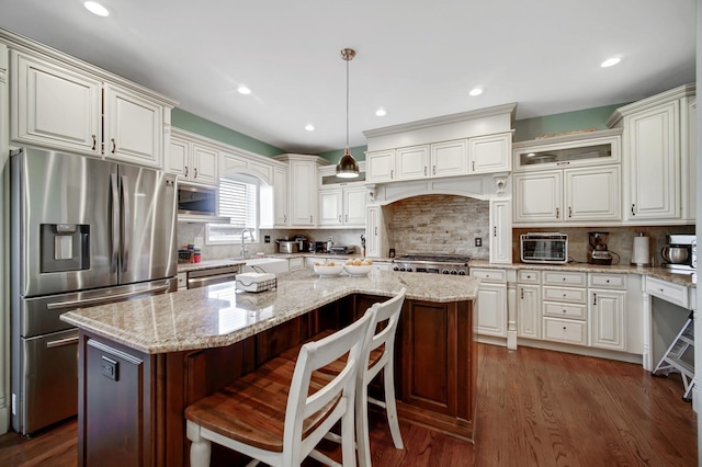 0N745 Bartelt Rd, Geneva, IL 60134 - kitchen with stainless steel fridge, a kitchen island, dark wood finished floors, range, and decorative backsplash