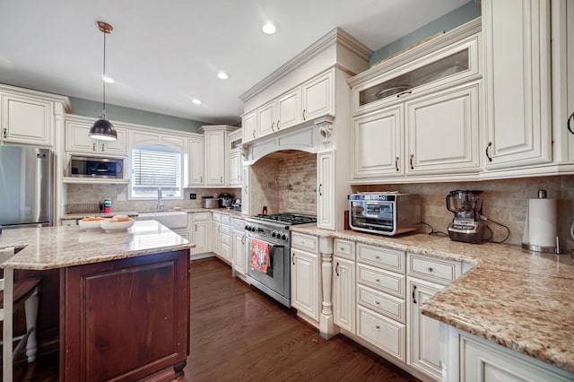 0N745 Bartelt Rd, Geneva, IL 60134 - kitchen with appliances with stainless steel finishes, a sink, light stone countertops, dark wood-type flooring, and tasteful backsplash