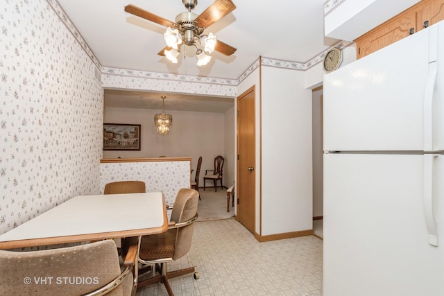 15309 S 73rd Ave Unit 15309, Orland Park, IL 60462 - dining space with wallpapered walls, ceiling fan, light floors, and baseboards