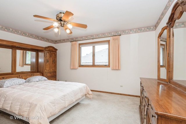15309 S 73rd Ave Unit 15309, Orland Park, IL 60462 - bedroom with multiple windows, light carpet, baseboards, and a ceiling fan