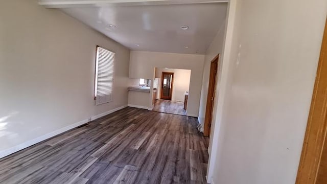 443 E St, Depue, IL 61322 - unfurnished living room with dark wood-style floors and baseboards