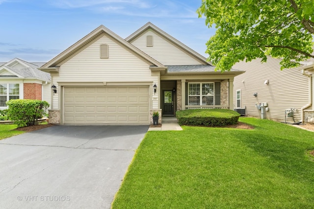 2507 Rolling Rdg, Elgin, IL 60124 - view of front facade featuring brick siding, asphalt driveway, a front yard, an attached garage, and central AC unit