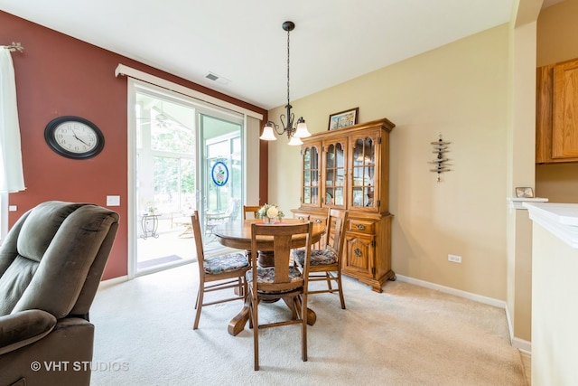 2507 Rolling Rdg, Elgin, IL 60124 - dining space featuring light carpet, a chandelier, and baseboards