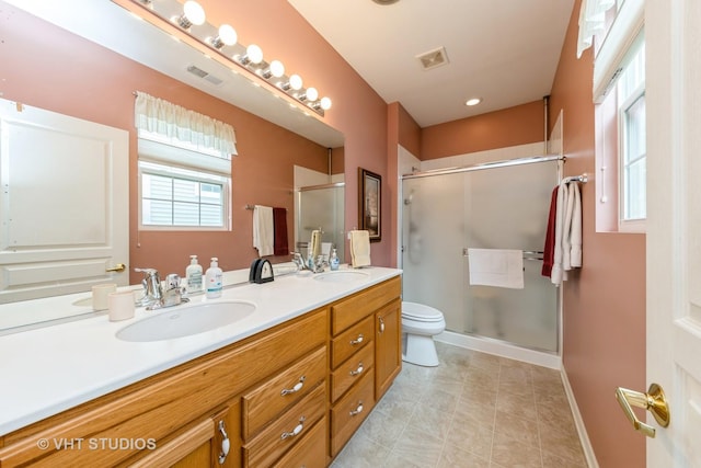 2507 Rolling Rdg, Elgin, IL 60124 - bathroom featuring toilet, a stall shower, double vanity, baseboards, and tile patterned flooring