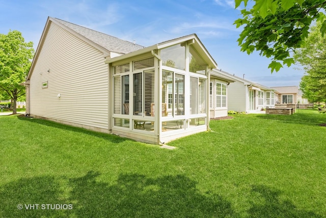 2507 Rolling Rdg, Elgin, IL 60124 - view of property exterior featuring a sunroom and a lawn