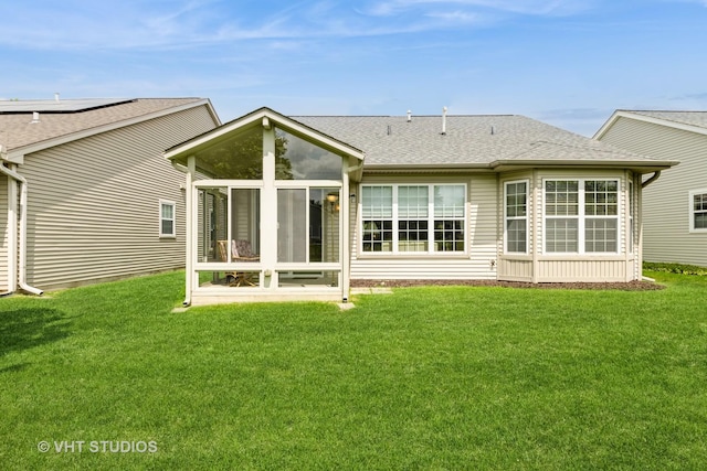 2507 Rolling Rdg, Elgin, IL 60124 - back of property with a sunroom, roof with shingles, and a lawn
