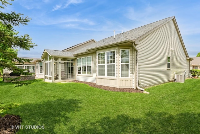 2507 Rolling Rdg, Elgin, IL 60124 - rear view of house featuring a sunroom, a shingled roof, a yard, and central air condition unit