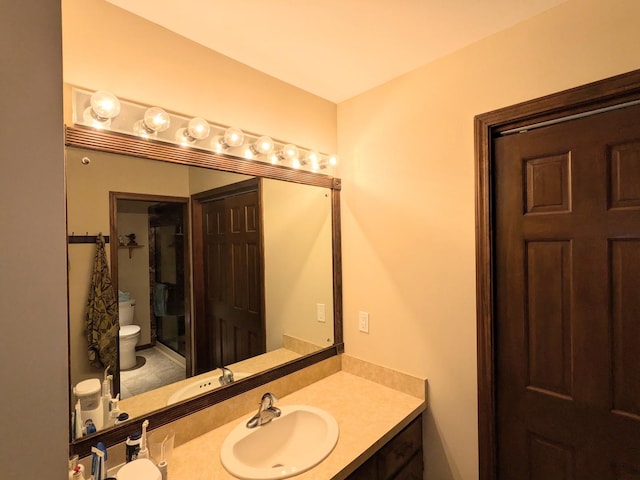 bathroom with vanity and toilet