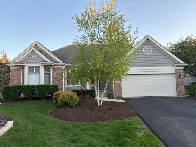 4 Biltmore Ct, Lake In The Hills, IL 60156 - ranch-style home with brick siding, driveway, a garage, and a front lawn