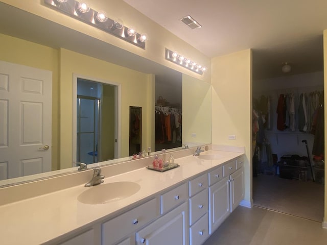 2018 Olmstead Dr Unit 2018, Woodstock, IL 60098 - full bath with double vanity, a spacious closet, and a shower stall