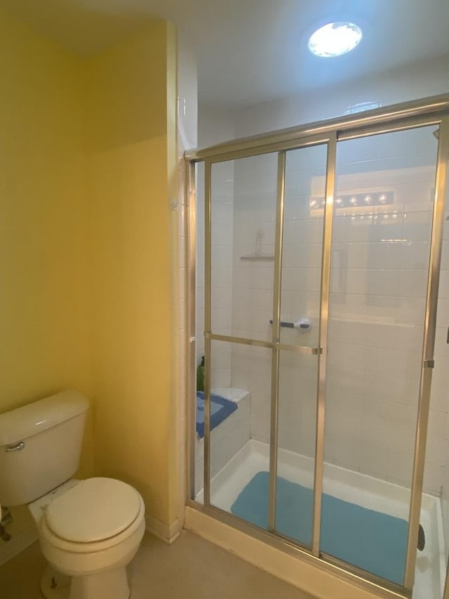 2018 Olmstead Dr Unit 2018, Woodstock, IL 60098 - bathroom featuring toilet and a stall shower