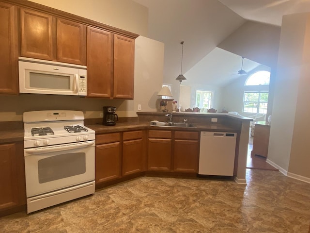 2018 Olmstead Dr Unit 2018, Woodstock, IL 60098 - kitchen with white appliances, a peninsula, vaulted ceiling, dark countertops, and brown cabinets