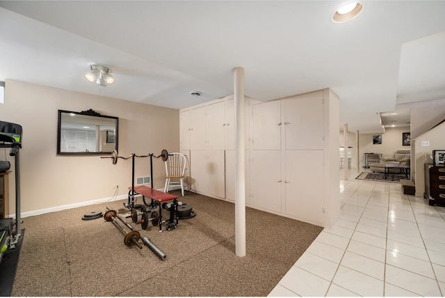 4522 N Reserve Ave, Chicago, IL 60656 - exercise room with baseboards, light tile patterned floors, and light colored carpet