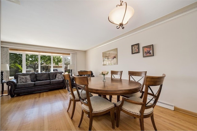 4522 N Reserve Ave, Chicago, IL 60656 - dining space with light wood-style floors and a baseboard heating unit