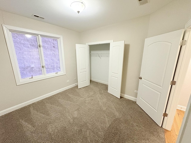 25 E 26th St Unit 2, Chicago, IL 60616 - unfurnished bedroom featuring light carpet, baseboards, and a closet