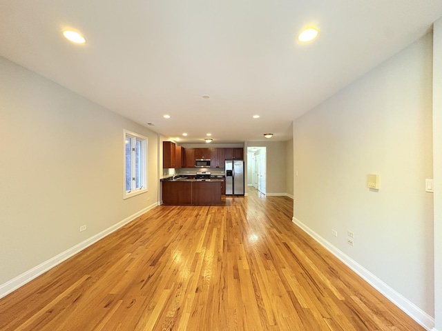 25 E 26th St Unit 2, Chicago, IL 60616 - unfurnished living room featuring light wood-style flooring, recessed lighting, and baseboards