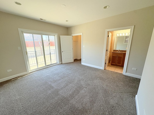 25 E 26th St Unit 2, Chicago, IL 60616 - unfurnished bedroom with carpet, access to outside, baseboards, ensuite bathroom, and recessed lighting