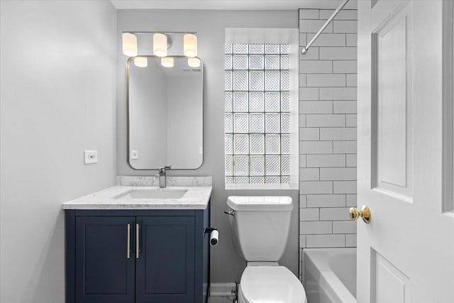 bathroom with vanity, toilet, and shower / bathtub combination