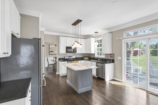 3174 Larrabee Dr, Geneva, IL 60134 - kitchen featuring appliances with stainless steel finishes, backsplash, dark wood-type flooring, crown molding, and white cabinets