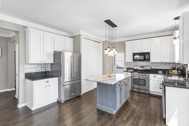 3174 Larrabee Dr, Geneva, IL 60134 - kitchen with stainless steel appliances, a sink, backsplash, dark wood-style flooring, and white cabinets