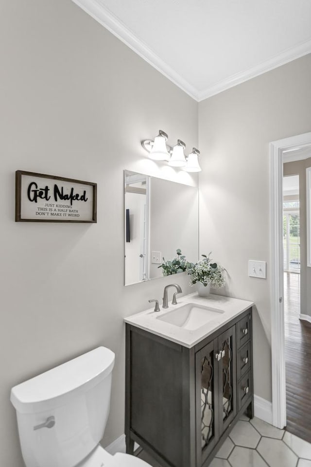 3174 Larrabee Dr, Geneva, IL 60134 - bathroom featuring ornamental molding, vanity, toilet, baseboards, and tile patterned flooring