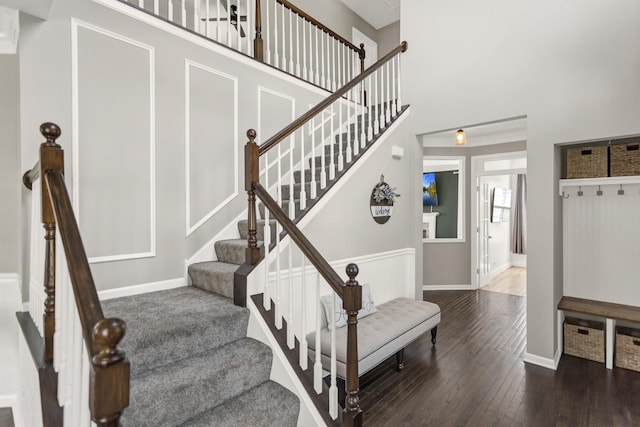3174 Larrabee Dr, Geneva, IL 60134 - staircase with hardwood / wood-style flooring, baseboards, and a towering ceiling