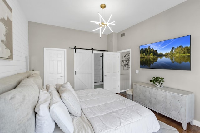 3174 Larrabee Dr, Geneva, IL 60134 - bedroom featuring a chandelier, a barn door, and wood finished floors
