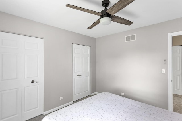 3174 Larrabee Dr, Geneva, IL 60134 - carpeted bedroom with multiple closets, a ceiling fan, and baseboards